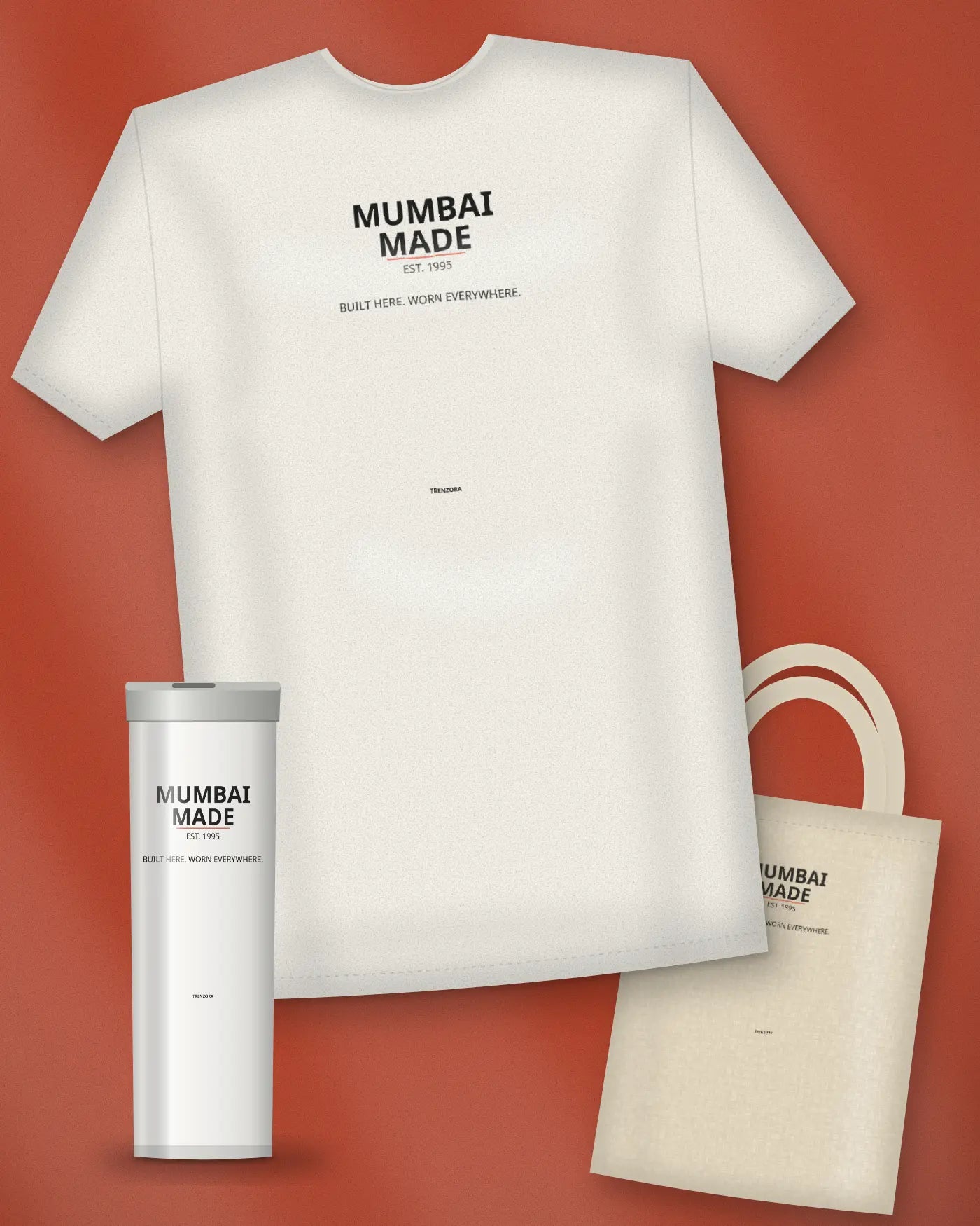 Mumbai Made oversized tee, tote and tumbler on a brick-red set